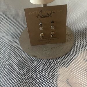 Stud earrings: skull, pave gold, black.